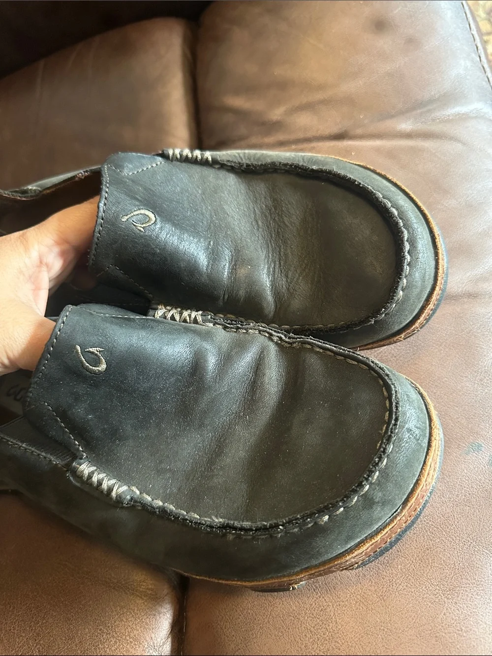 OluKai Men's Black Slip-On Loafers with Brown Trim